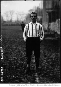 Raymond Dubly stating on grass wearing soccer uniform
